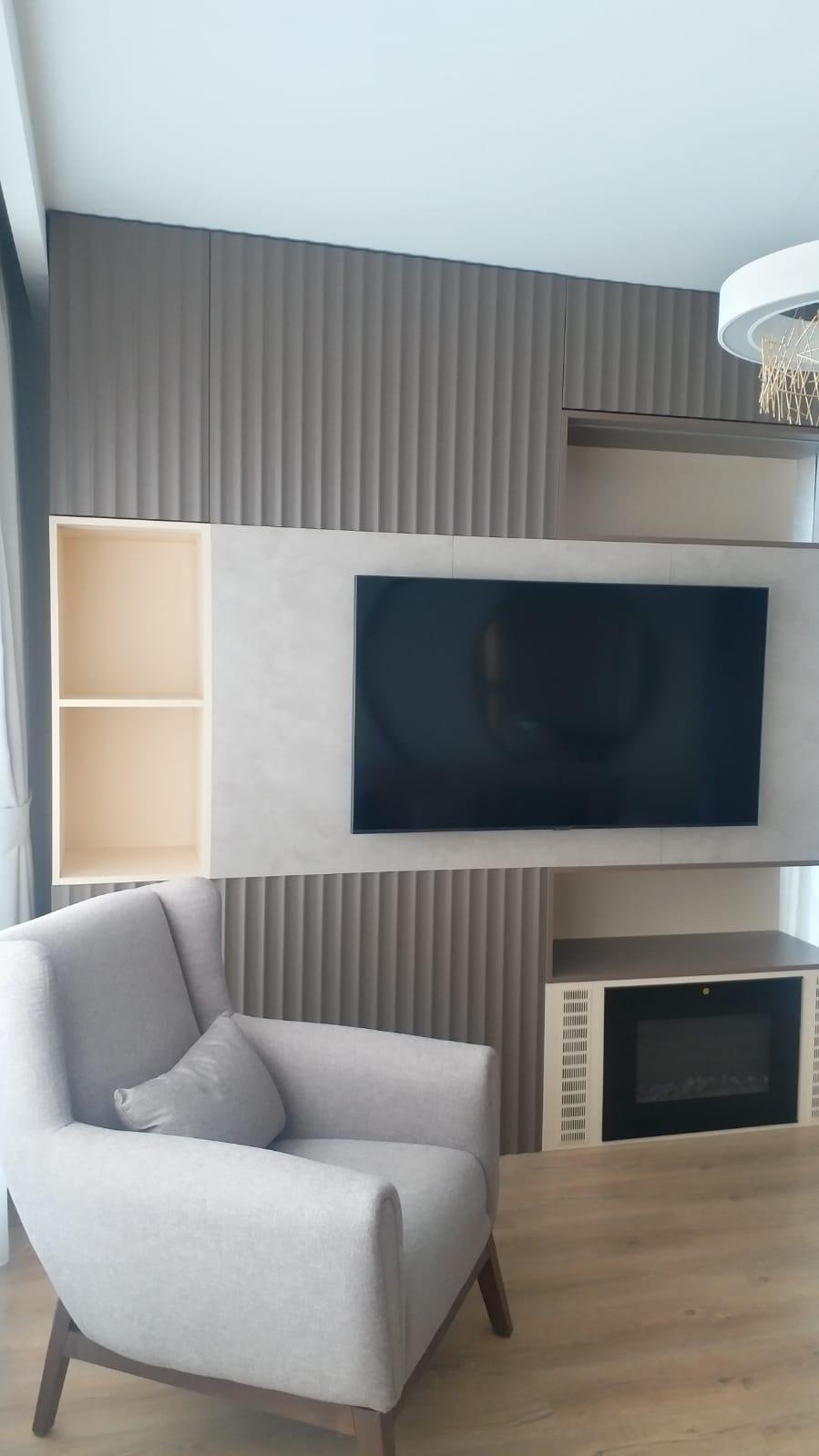 Fluted panel wall unit with built-in electric fireplace